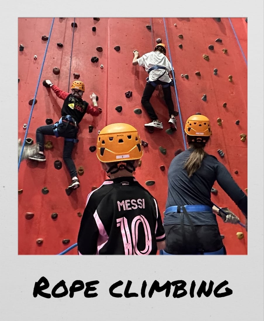 Polaroid image of kids near a climbing wall, titled “Rope climbing”