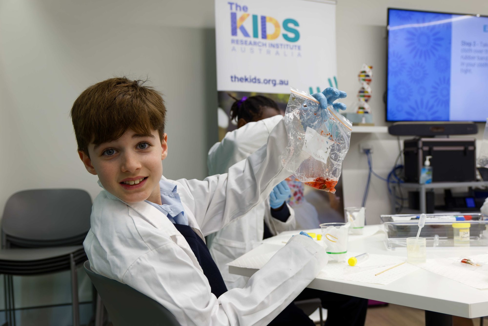 child conducting a science experiment