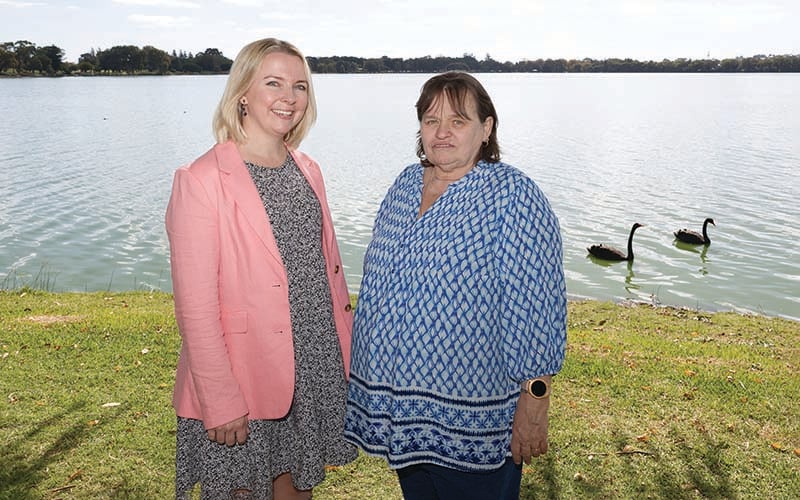 Dr Angela Fuery and Sharon Gregory standing by a river